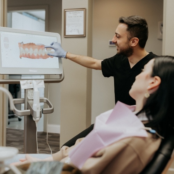 Putnam dentist showing a patient x rays of their teeth