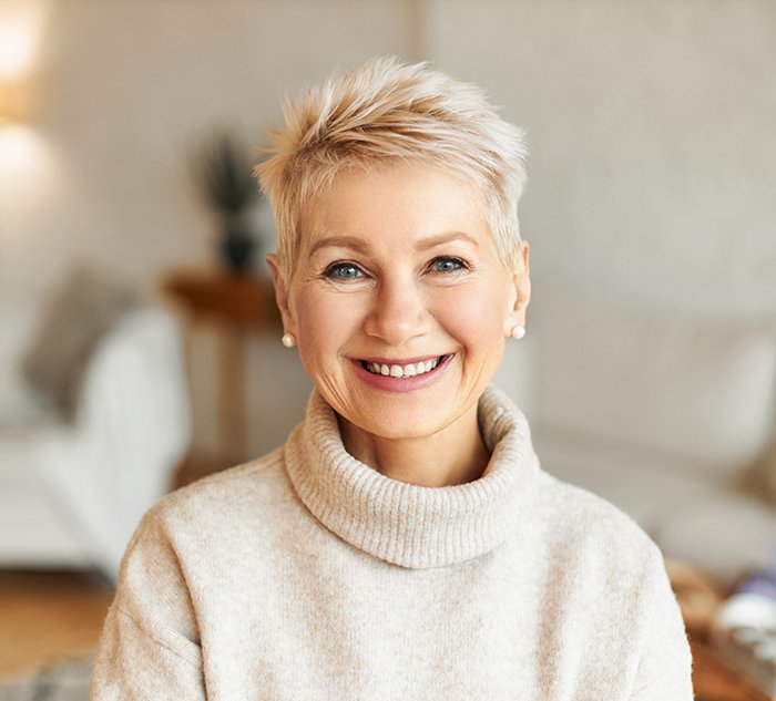 A beautiful older womn showing a pretty smile