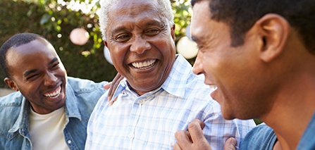 Patient in Putnam talking to family after getting dentures