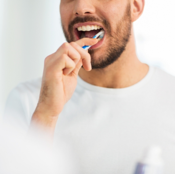 Man brushing his teeth