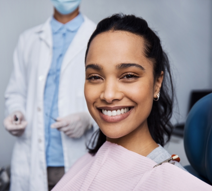 Smiling woman sitting in dental chair