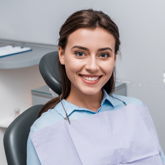 Young woman smiling in dental chair