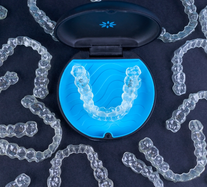Pile of several Invisalign clear aligners in Putnam