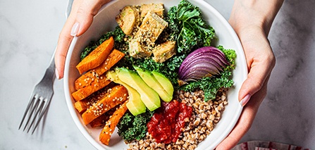 Patient holding bowl of healthy foods