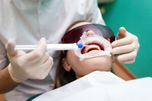patient undergoing professional teeth whitening